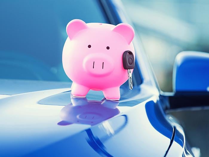 image of a piggy bank with a car key